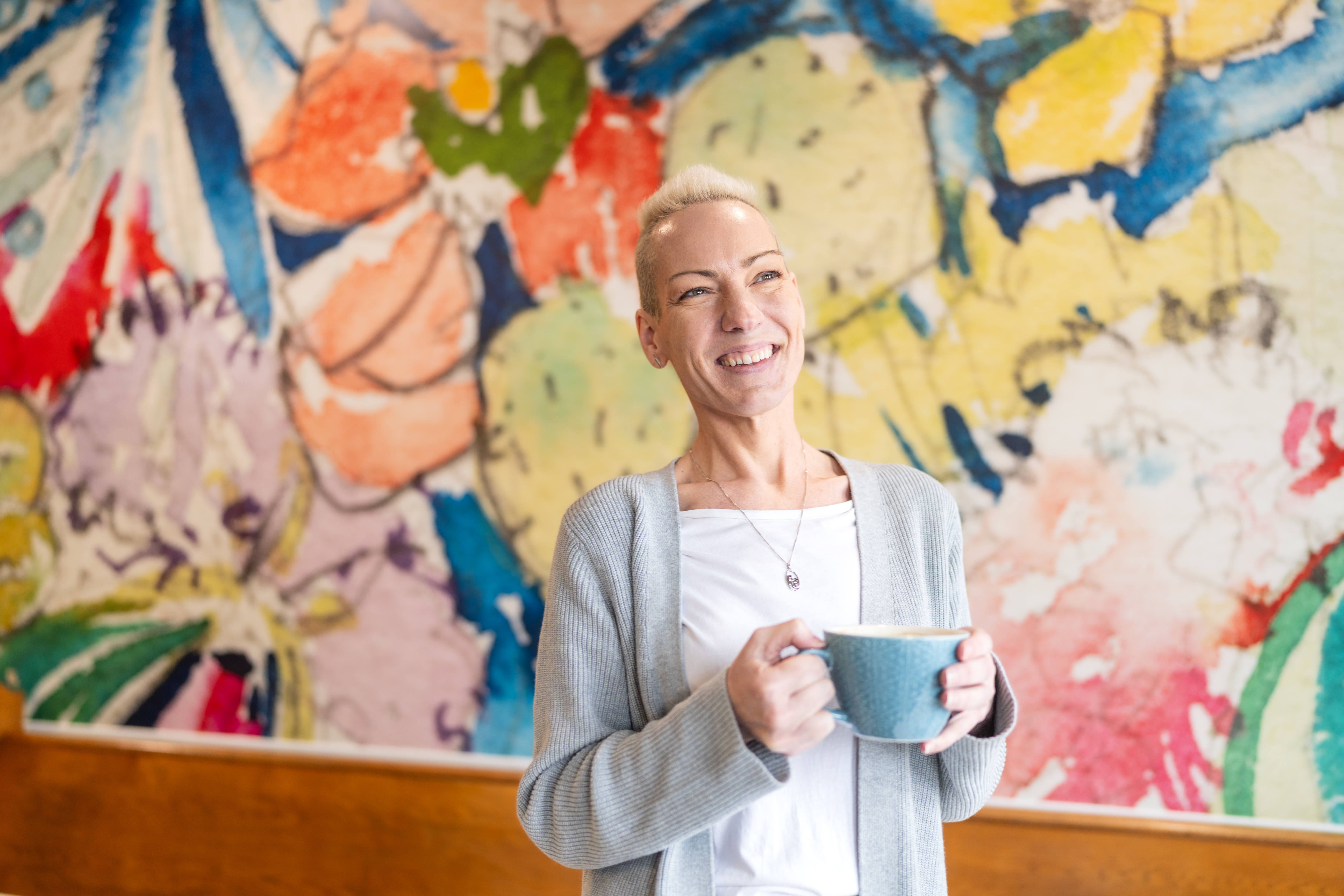 Cheryl MacLean stands with a coffee cup in hand at Marmalade Motel in Port Dufferin.