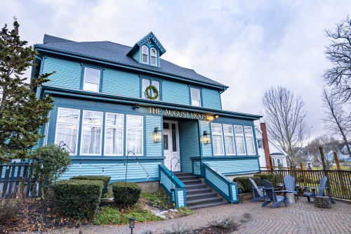 A picture of the front of The August House in the winter. 