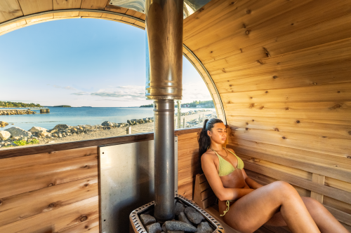 Woman relaxing in Sauna at Wilson's Coastal Club