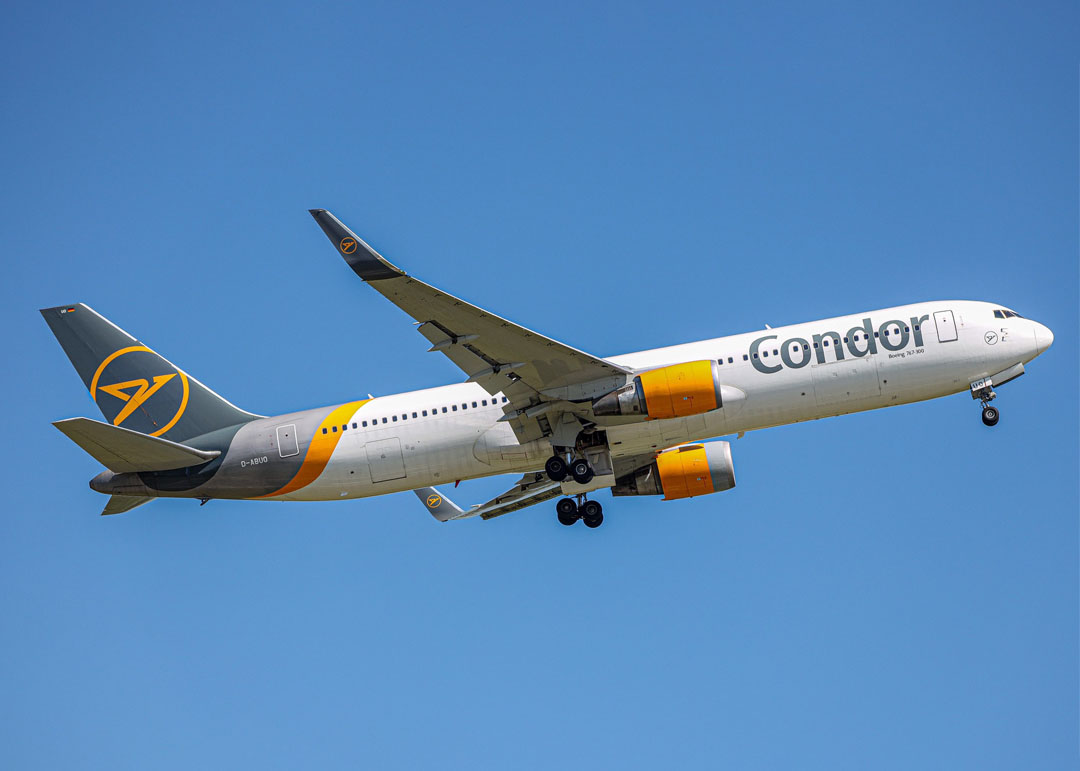 Condor Airline jet in a blue sky.