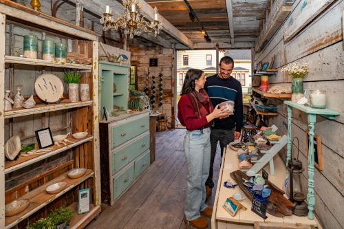 Guests admiring the pottery in Dirt To Dishes Pottery studio. 