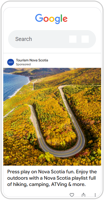 A hair pin turn in the road in Cape Breton Island. The drone image shows the road and fall colours on the trees.