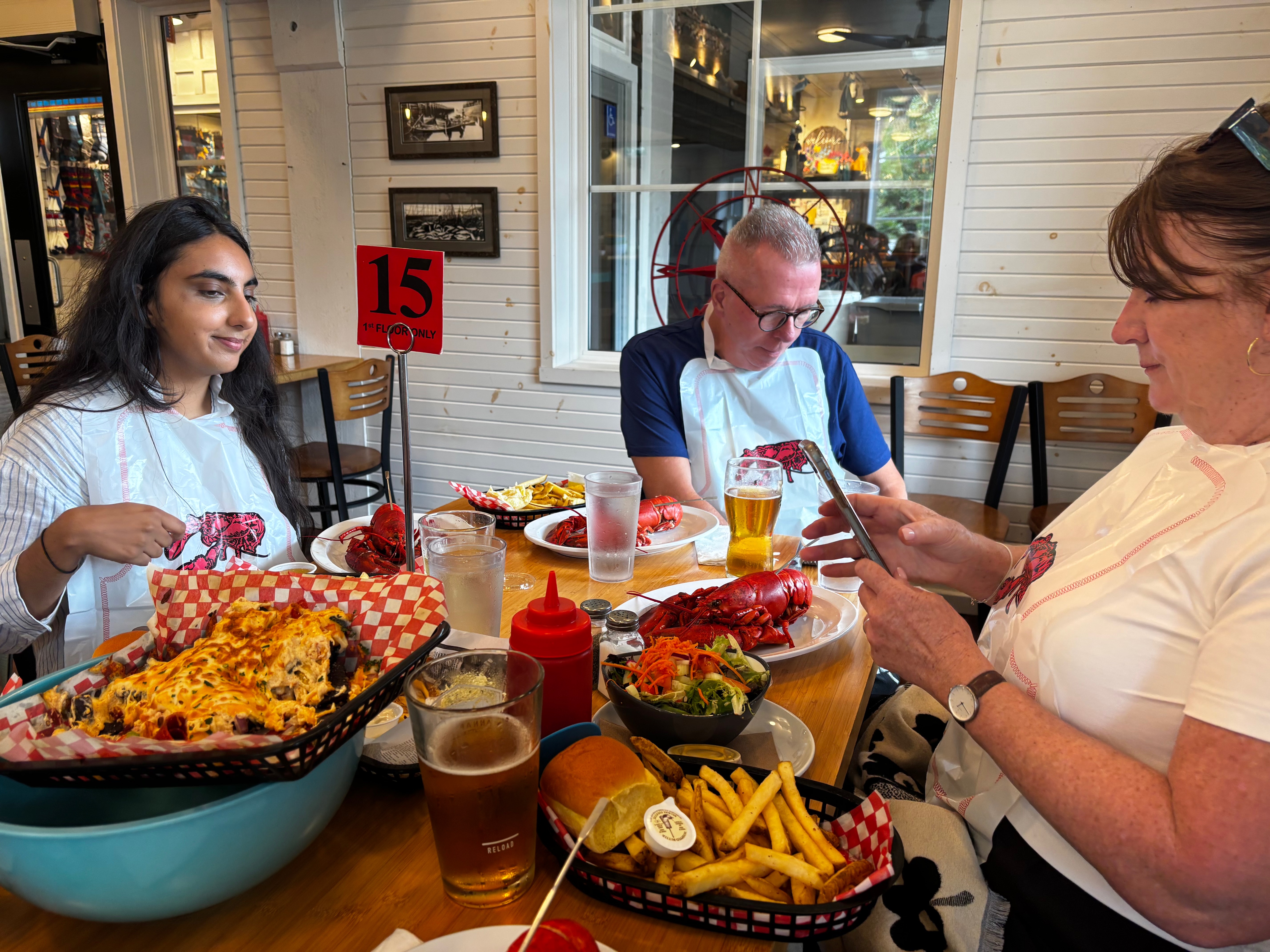 A group shuck lobster at the Halls Harbour Lobster Pound. 