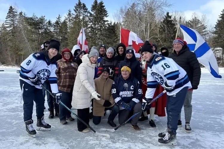 Minister Ritcey does ceremonial puck drop at the 2026 Long Pond Heritage Hockey Classic in Windsor, Nova Scotia. 