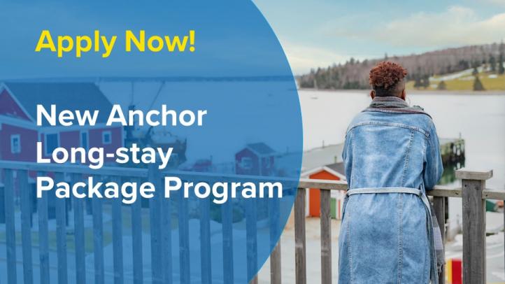 Photo of a woman leaning on a balcony railing looking out over Lunenburg Harbour. There are red buildings below and the ocean. A transparent blue circle covers part of the image and text reads: Apply Now! New Anchor Long-stay Package Program