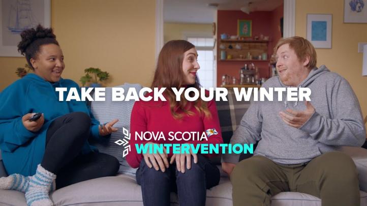 Image of a woman sitting between a couple on their couch. Text reads: Take back your winter.