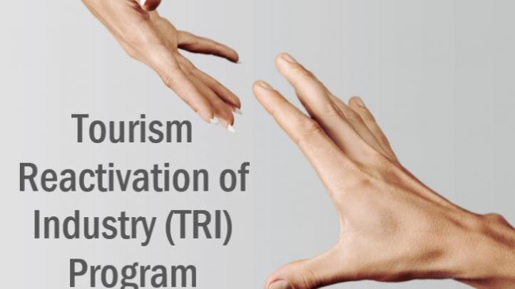 Two hands reaching for each other. Text reads Tourism Reactivation of Industry Program