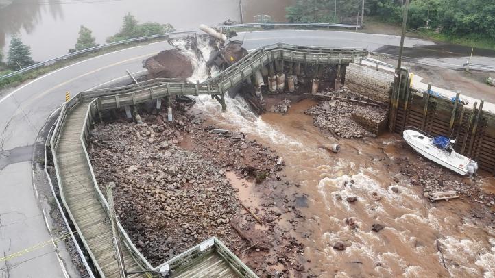 Flood damage in Halls Harbour is seen Friday, July 12. The bridge is damaged.