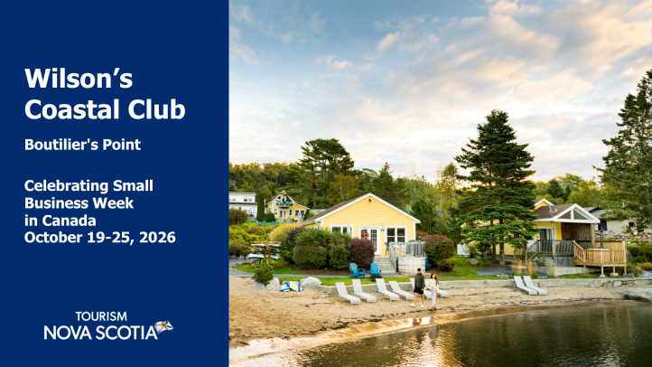 A view of the cottages on the shore at Wison's Coastal Club. There is a beach with beach chairs too. 