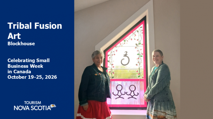 The owners of Tribal Fusion Arti stand next to a window that was commissioned. 