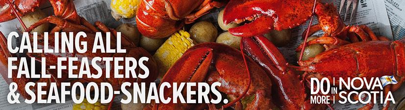 Digital billboard ad showing lobster dinner with text that reads: Calling all fall-feasters and seafood-snackers.