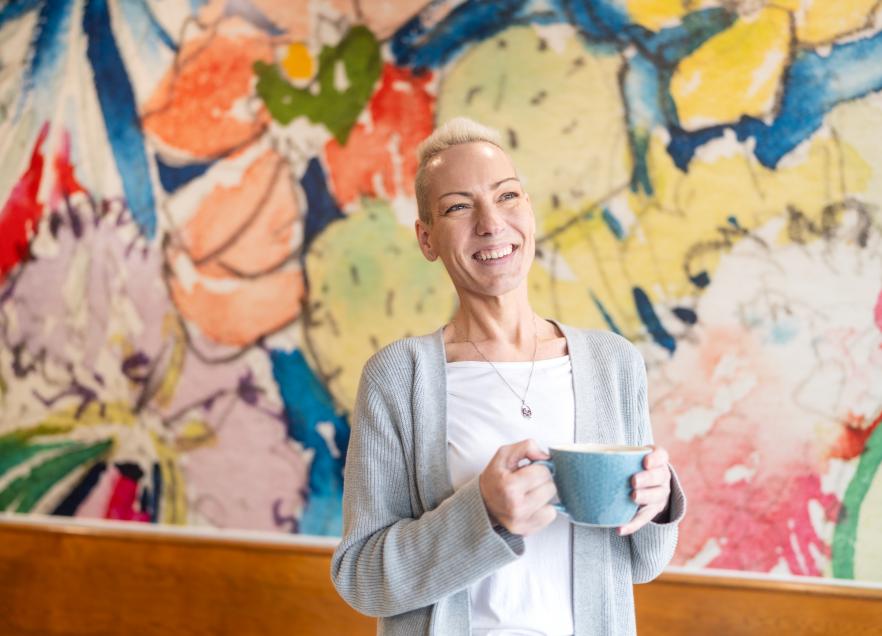 Cheryl MacLean stands with a coffee cup in hand at Marmalade Motel in Port Dufferin.