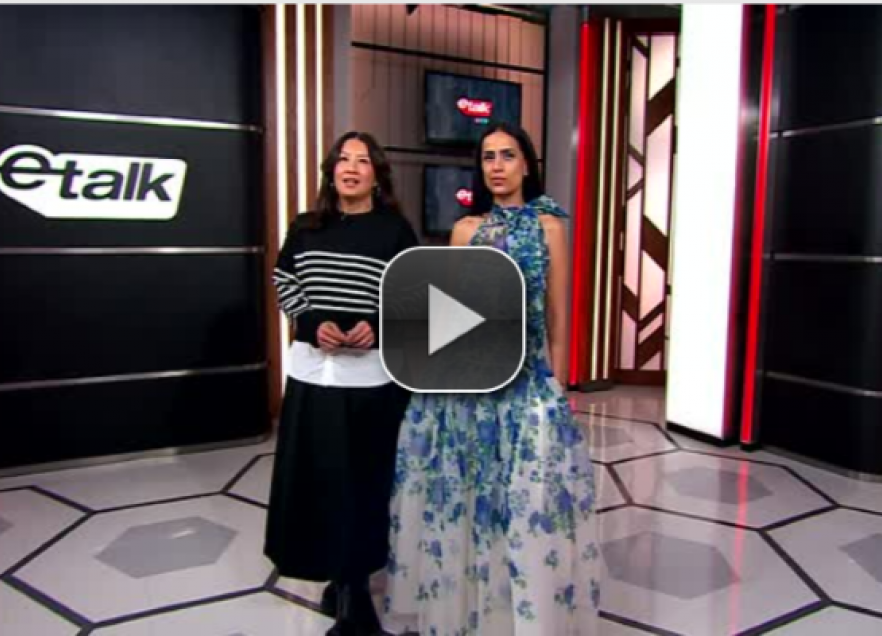 Image of a segment of the TV program E-talk with two presenters on stage.  