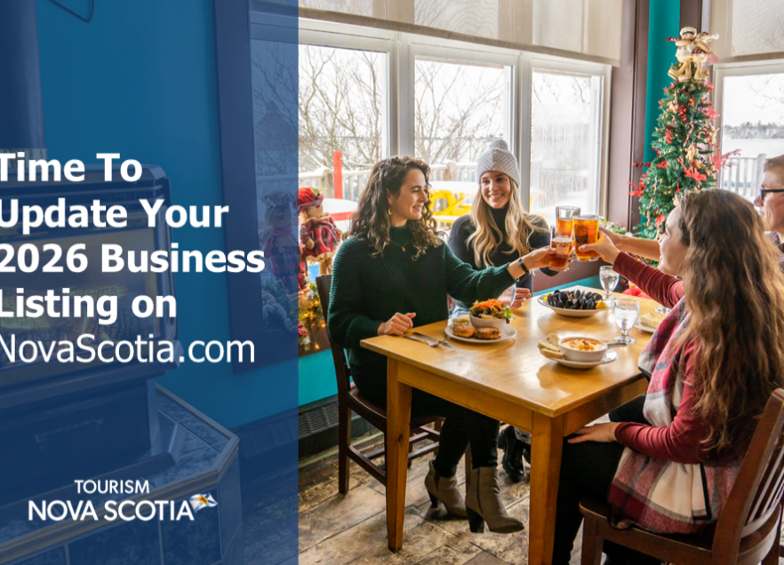 A group of four people sitting at a table saying 'Cheers". 
