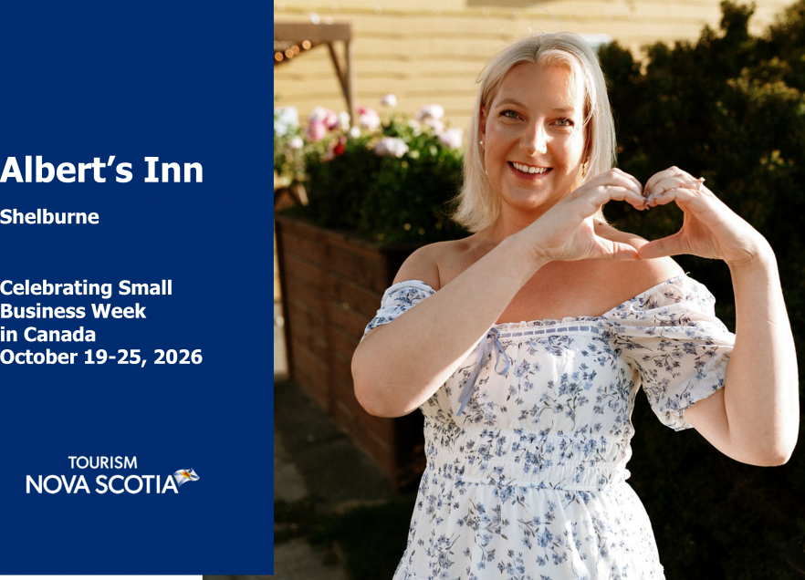 Stephanie Wessoleck makes a heart shape with her hands while she stand outside Albert's Inn. 