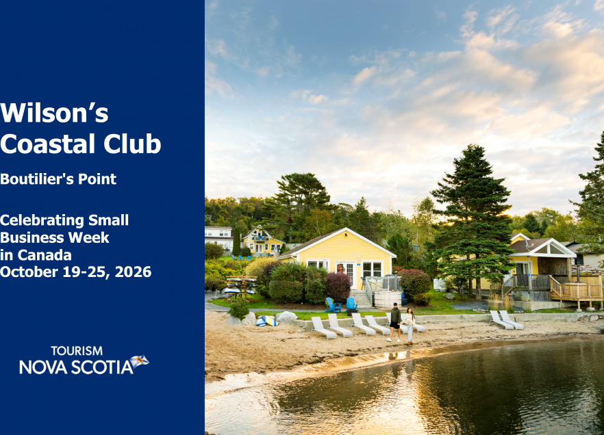 A view of the cottages on the shore at Wison's Coastal Club. There is a beach with beach chairs too. 